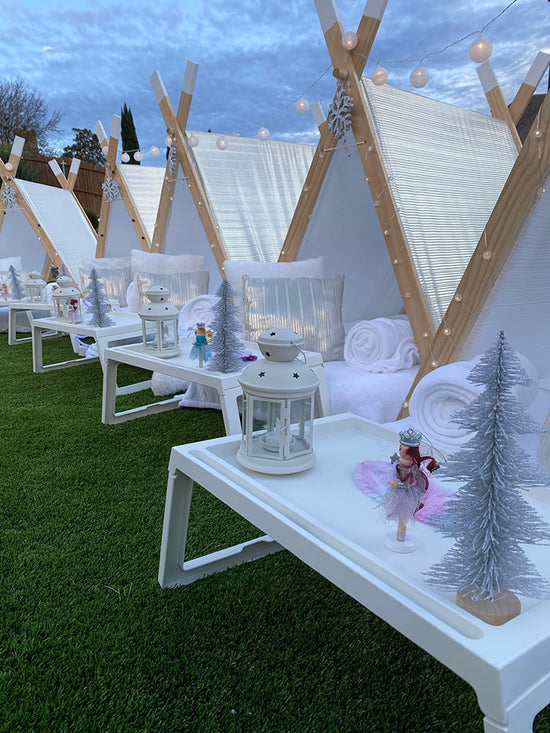 Winter wonderland themed tent campsite party